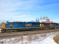 <b>Brand new and older GE's in matching paint schemes.</b> Nearly brand new ET44AC CSXT 3339 leads CN 327 through Dorval after waiting for VIA 50 to pass on the north track. Trailing is an older GE, AC4400CW CSXT 83, which has been repainted in the same current paint scheme that 3339 wears.
