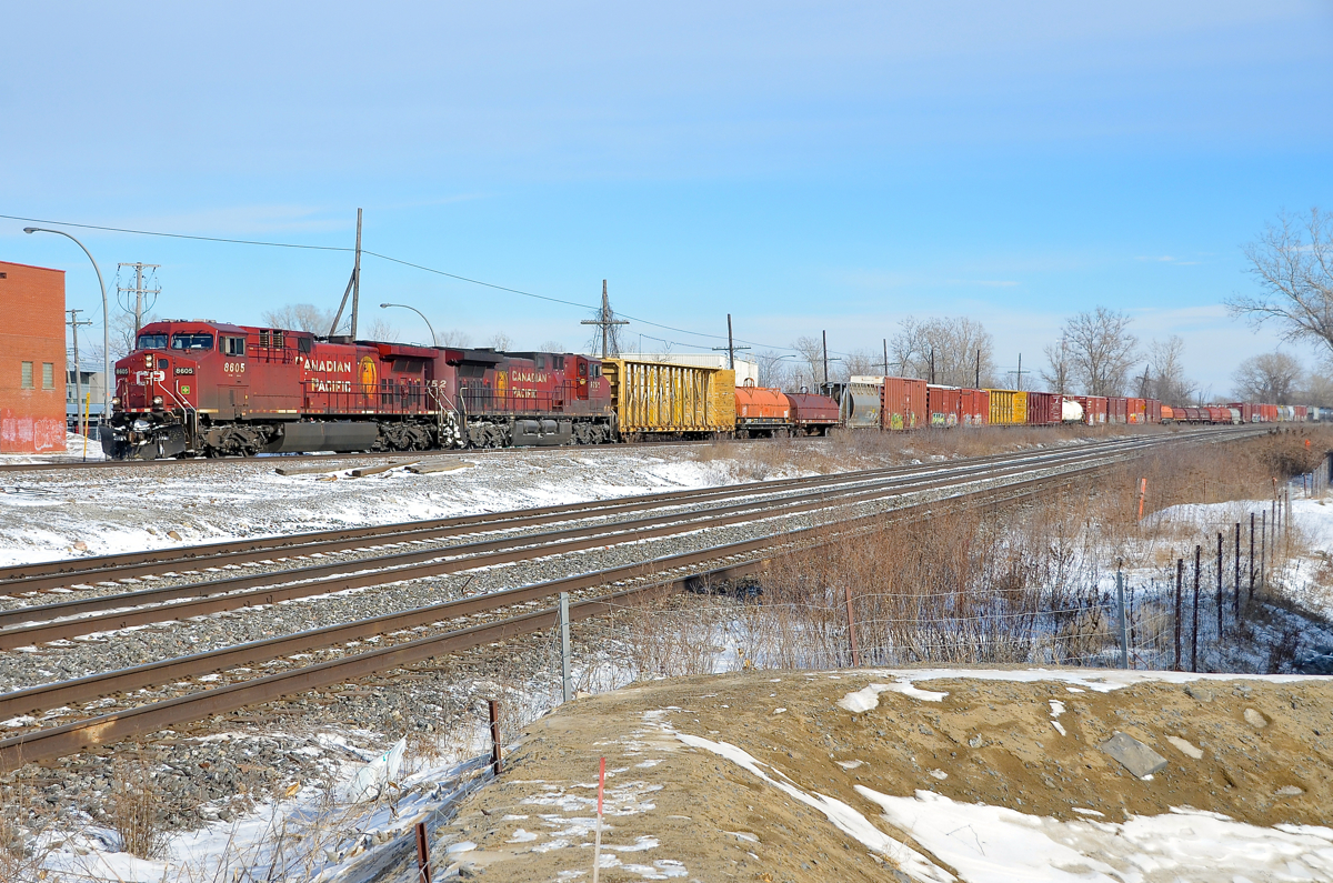 A pair of beavers. CP 119 slowly starts to pull after the conductor got onboard at Dorval. Power is a pair of AC4400CW's (CP 8605 & CP 9752) with the Beaver logo on the long hood.
