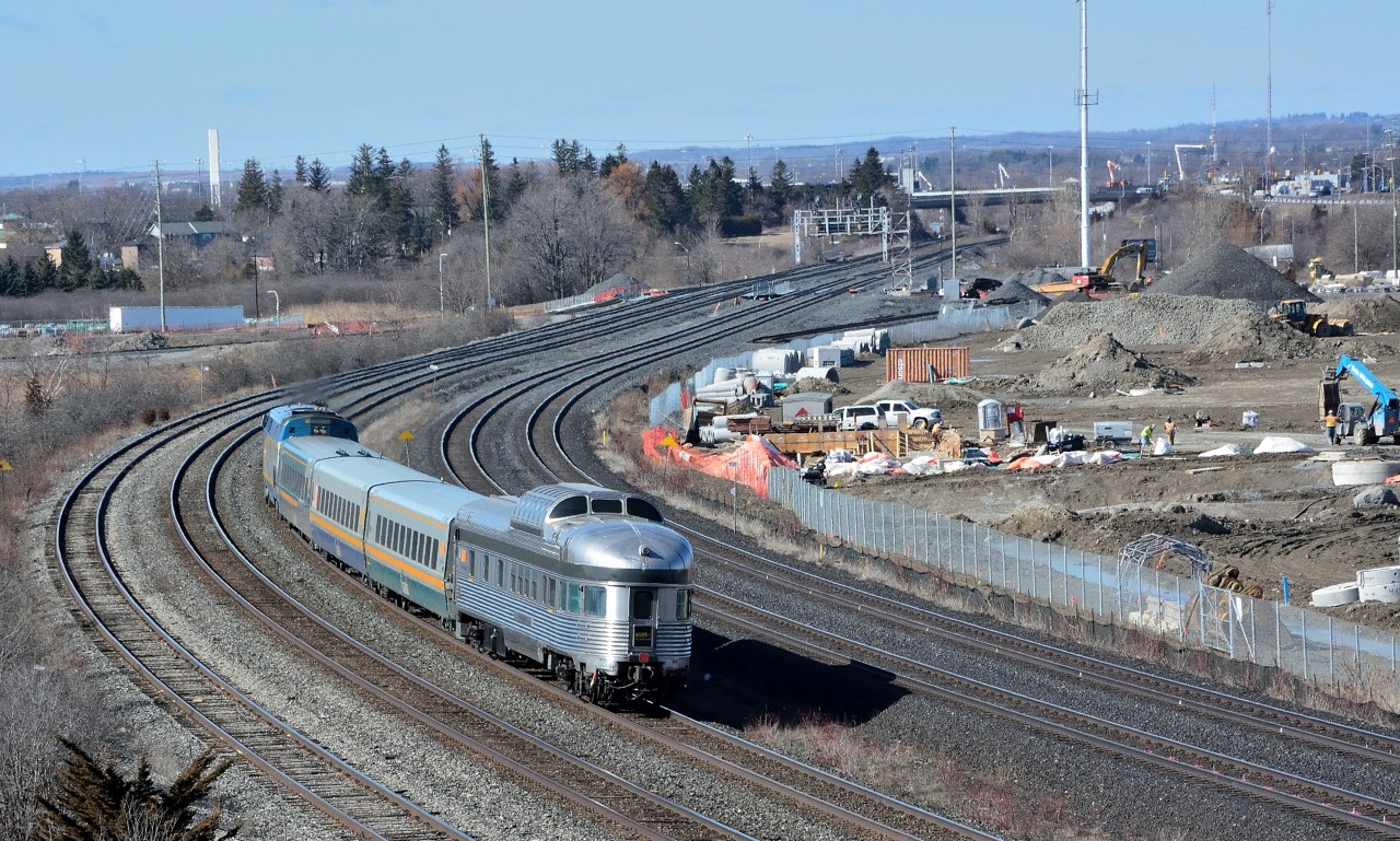 A compete train.


Very nice touch.


Can anyone think of a better way to finish an inter-city train?


VIA Train #61 offered three levels of accommodation today:


Coach Class


Business Class


Prestige Class


One of four Park cars rebuilt 2011-2012 by Avalon Rail, Milwaukee:  8706 Glacier Park;  8708 Kootenay Park;  8709 Laurentide Park;  8710 Prince Albert Park. So, anyone know the identity of this Park?


2001 GE built  P42DC  #911 is train #61 power. 


On a dry, warm, snowless ….after all this is the 'banana belt'....February 22, 2016 at Hopkins Street, image by S.Danko


…I do miss the CP RAIL action red:


 at an ex GTR station  
 

sdfourty


p.s. The new GO rail service centre takes shape on the north (right ) side.


[…hey hey, no doubt the Park car was dead-heading, but it would be nice if.....]


So, anyone know the identity of this Park?