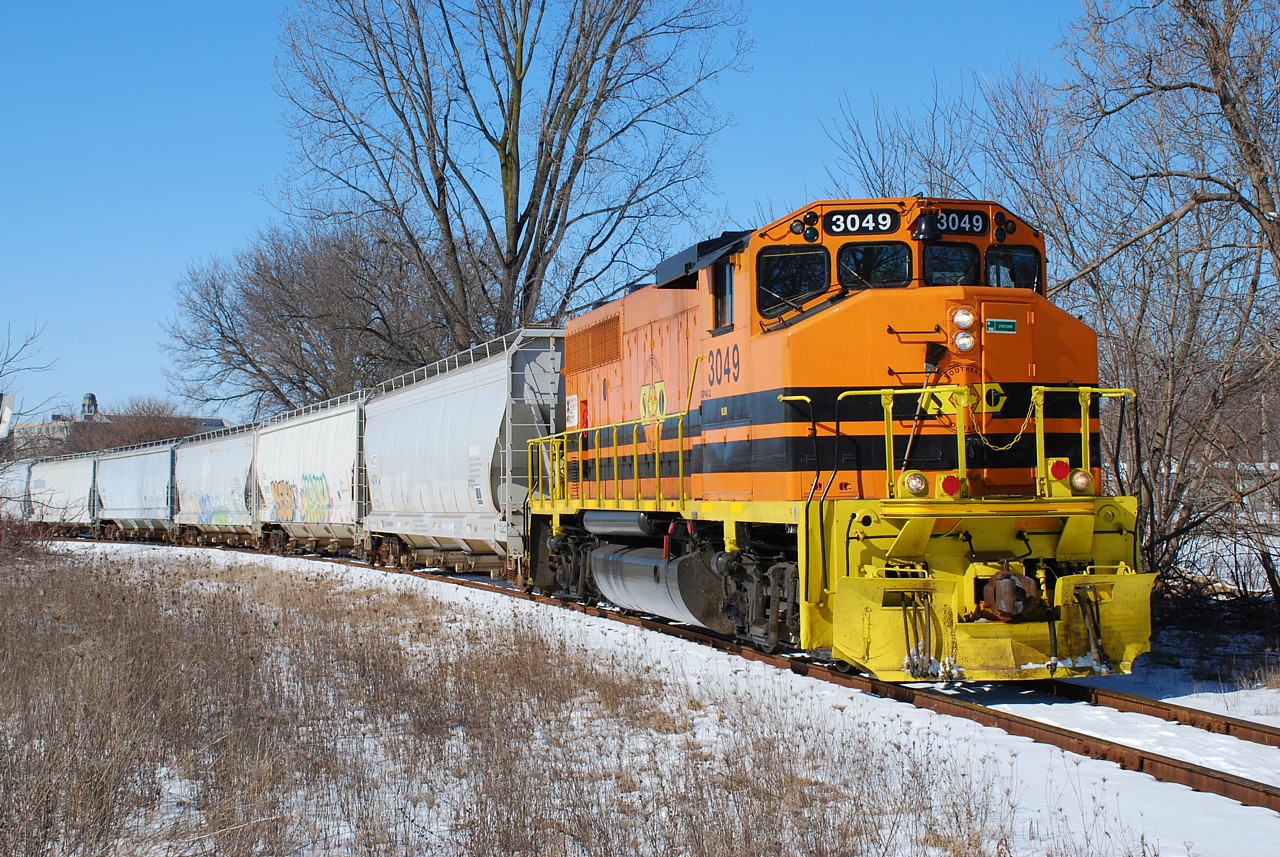 I finally managed to get a decent photograph of RLHH 3049 after over a year of RLHH serving Ingenia on what is left of the Burford Spur and TH&B in Brantford.  RLHH 3049 is shown shoving six hoppers just east of Eagle Avenue, passing what was once TH&B's Newport Yard.  

It saddens me to inform the railfan community that in a few minutes after this photograph was taken, I missed the highly sought after "over/under" photo with RLHH 496 stopped at Brant Jct. and CN 580 passing overhead on the Hagersville Subdivision returning from Cainsville.  Missed it by seconds.