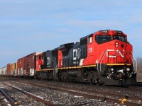 An eastbound consist rolls through the yard with a mixed freight.CN 2159 & 5766 in charge.