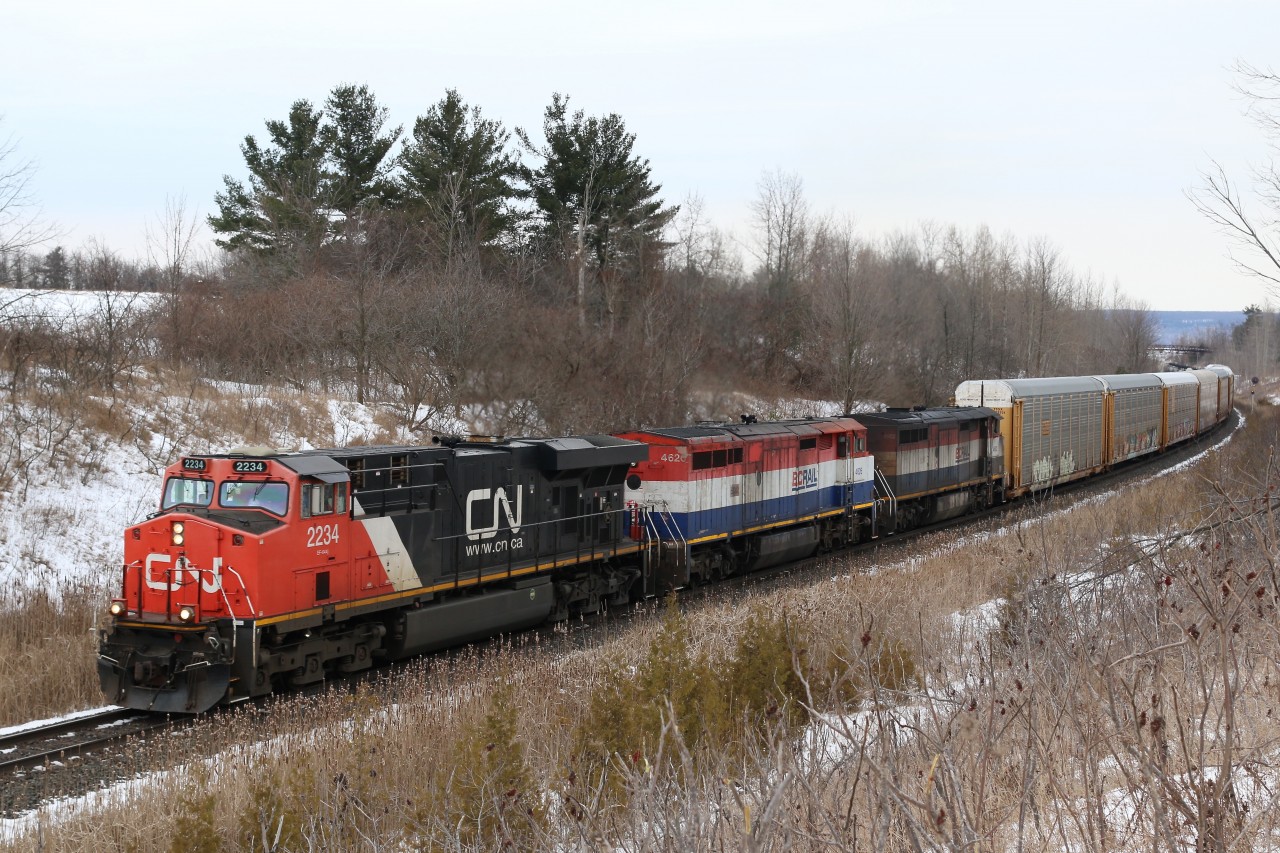 A very heavy CN train 422 rolls through Halton Hills at a location best known as Scotch Block. Today's train has a pair of BC Rail Dash 8s in tow as it heads for Toronto yard.