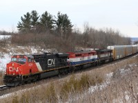A very heavy CN train 422 rolls through Halton Hills at a location best known as Scotch Block. Today's train has a pair of BC Rail Dash 8s in tow as it heads for Toronto yard. 