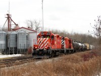 After doing the switching at Guelph Junction, OSR 8235 leads OSR 1591 in to the village of Moffat and past Sharpe Farm Supply on their way back to Guelph. OSRX 434462 was tagging up the rear once again.