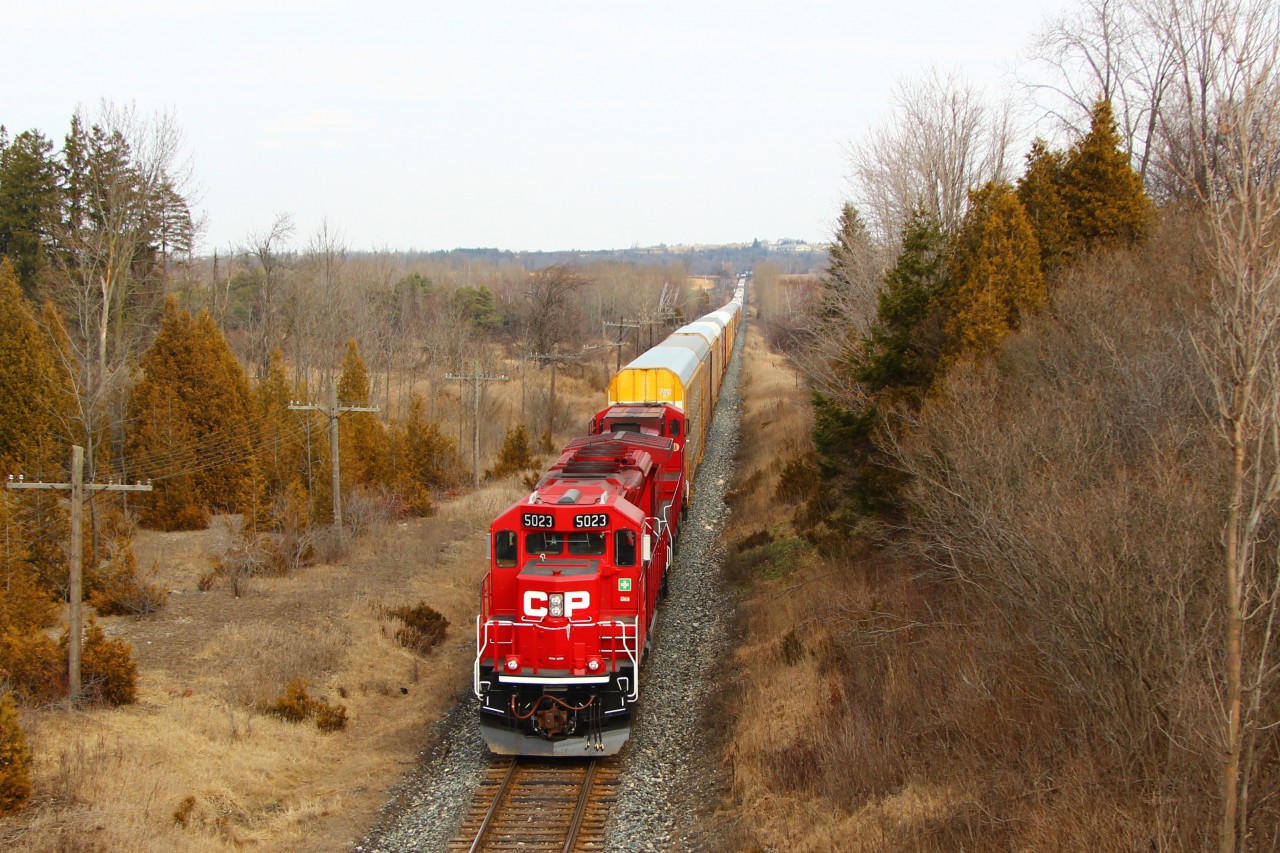 CP 5023 (SD30C-ECO) leads CP 9731 up to the Highway 6 overpass and MM45 on the Galt sub with running lights off as they prepare to stop on the Puslinch Main and meet two eastbound CP units approaching to head down the siding.