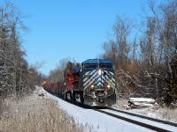 After waiting for CP 9805 to exit the Hamilton sub and go west bound, CEFX 1043 leads CP 8938 down the Hamilton sub up to the Carlisle Road crossing at MM 71.21 on a cold but sunny morning.