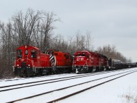 OSR 1210 along with OSR 1591 work on a switch in Guelph Junction while the track rail train, CP 3017, sits idling waiting for its crew to arrive to head west.