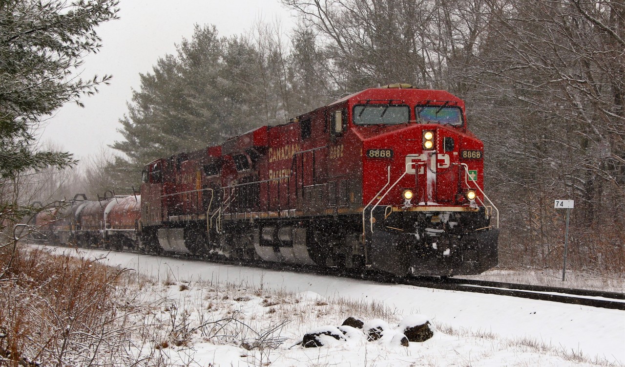 On a very snowy afternoon, CP 8868 leads CP 8635 down the Hamilton sub past MM 74 on its way to Desjardins.