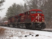 On a very snowy afternoon, CP 8868 leads CP 8635 down the Hamilton sub past MM 74 on its way to Desjardins.