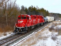 After doing a switch at Guelph Junction, the daily "pick-up" train consisting today of CP 2250 and CP 2325 (GP20C-ECO), are returning westbound with a new manifest of five cars as they cross SR 20 and MM 49.3 on the Galt sub.
