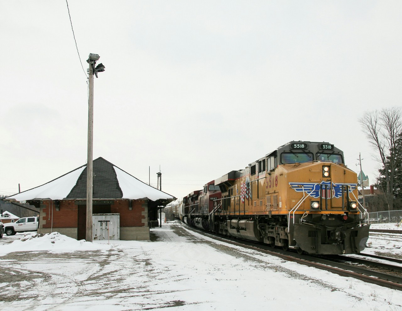 CP 242 rolls past Galt, Ontario with a Union Pacific leader. It's nice to see a regular night train running a day shift on the Galt.
