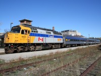 A three car VIA 85 makes a station stop at Guelph.