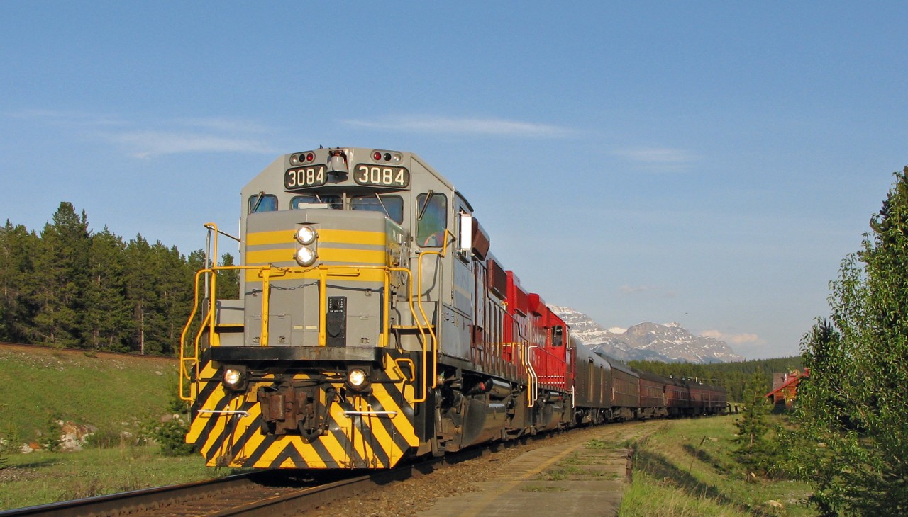 A lucky catch while out evening railfanning. CP 3084 with 3049 leads a special that ran from Calgary to Lake Louise. Here it is paused at the Lake Louise station. The engines will then detach from the train and run ahead a few miles, come back down the north track, and then swing back to connect to the rear of the train then head back to Calgary.