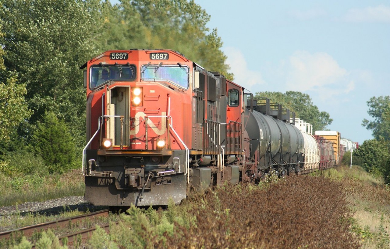 CN 5697 roars through the countryside approaching the Sarnia city limits with a westbound freight on a beautiful late summer day.

I think this was probably train no. 331.