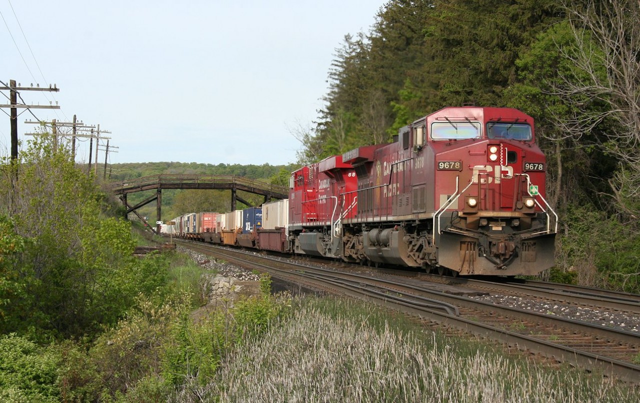 CP AC4400CW 9678 leads a then still brand-new 8800 series ES44AC up the hill with a westbound freight just east of Campbellville, Ontario.