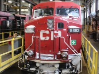 Coming in out of the cold this GE warms up in the Diesel Shop and has it's batteries on charge.