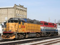 With the old H. Krug Furniture Co. mill forming the classic backdrop, Goderich-Exeter Railway's Kitchener local power idles away a quiet Sunday afternoon.