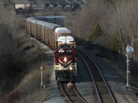 Work OSRX 1620 (returning to Woodstock with OSRX 182 in the lead) is stopped in the siding at the dwarf signal while the trainman heads forward to the yard switch.