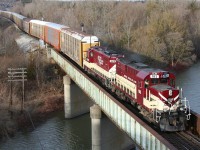 Ontario Southland's daily interchange job trundles across the Thames River with RS-18u 182 and GP9u 1620 and a sizeable string of empty auto racks for the CAMI plant in Ingersoll.