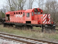 The "Monument". ex-Canadian Pacific control cab unit (ex-RS-18) 1116 was acquired by Ontario Southland for parts for their other MLW built units. Stripped of its trucks (not included in the sale) the derelict body rests behind the enginehouse at Guelph Junction.

Note: taken on railway property with permission.