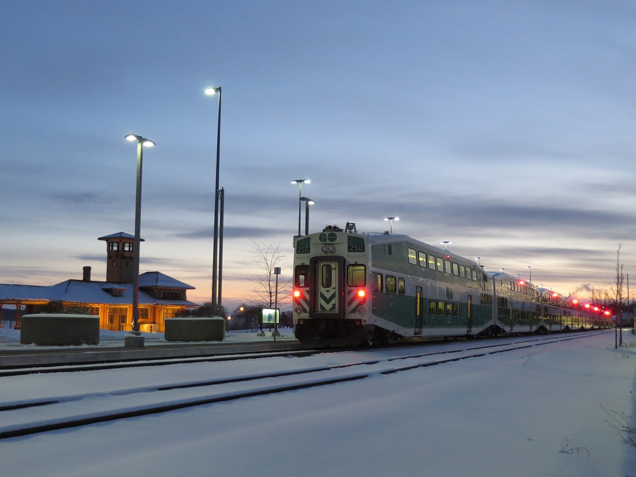 The last southbound train loads at the Allandale Waterfront station. The partially restored Grand Trunk Allandale station is in the distance. The days are getting shorter, last week this was a night shot.