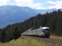 VIA Rail's westbound Canadian was pretty close to the advertised as it passed through English shortly before arrival in Jasper. Before repainting the Park cars were a fitting tale end of a train. Nowadays this thick black  line, well... In the far background Whistlers Mountain may be seen. 