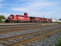 <b>The right leader.</b> CP 5907, CP 9620 & CP 9132 lead a westbound through Dorval in 2008. In the foreground are four tracks. The three closest are part of CN's Montreal sub, which will become CN's Kingston sub in a few hundred metres. The furthest track was the CN/CP interchange track, removed and relocated a couple of miles west about two years later. 