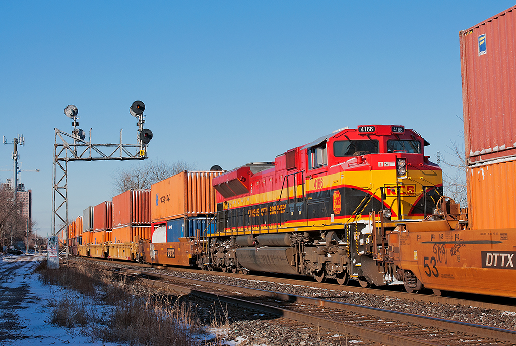 With cold bitter temperatures around for the weekend, it was creating havoc for both railways. KCS 4166 lends a hand 6,400 ft in as the mid train remote to keep the air flow down as the train slowly snakes it's way into Lambton. Upon arrival, the crew will switch out the Detroit blocks from the Chicago blocks for CP 235 to lift later and derobotize and run convention from Lambton onwards.