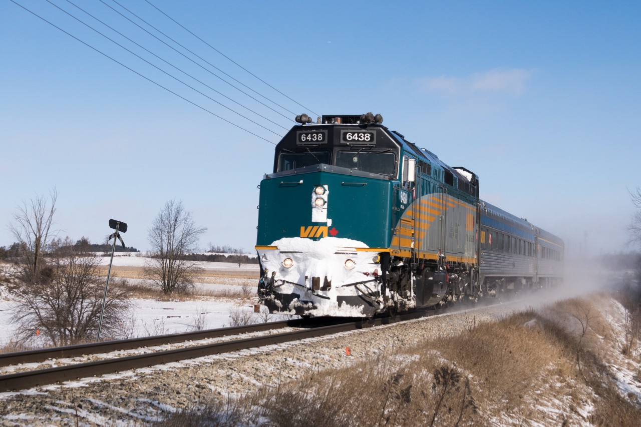 Right on time, VIA 85 kicks up snow approaching Fourth Line just west of Rockwood.