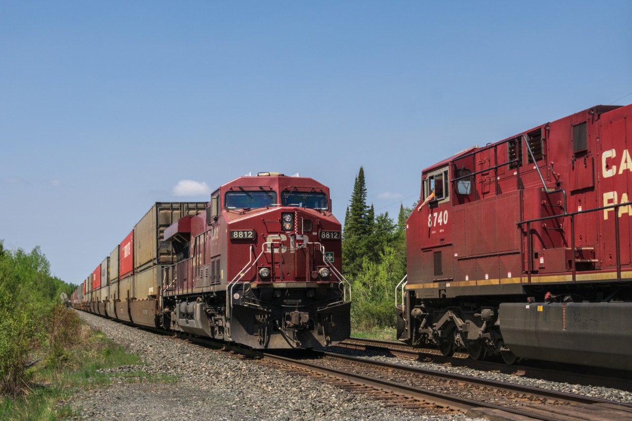 It's an hour later and I'm about 35 miles to the west, at the top end of Secondary Highway 603 in Dyment. A bird of prey overlooks the meet going down here at the east end of the siding. Said bird and obligatory carnivorous insects of the north were not the only wildlife present; a pair of black bear cubs were eating on the shoulder of the highway just south of here. Thankfully mama bear did not show up to try to protect them from me and the crew.