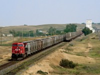 A westbound potash clears the west end of Parkbeg siding while an eastbound container train sits in the hole.