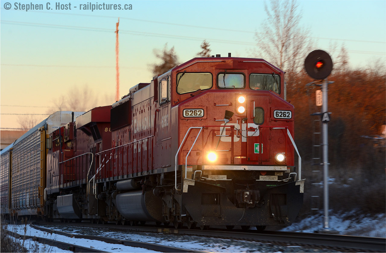SD60M 6262 is wasting no time in the charge of train 255 as they make track speed for Wolverton. With the sun having nearly completely set, I pulled a photographic hail mary. As the train was finally coming I decided there wasn't enough light for what I wanted,  so I set ISO down to 250, threw the F/stop to about F/10 for 1/125s and as the train rolled by, zoomed the lens from 200mm to 100mm hoping to get something sharp and got four or five frames off. Only one was sharp, this one at 145mm.