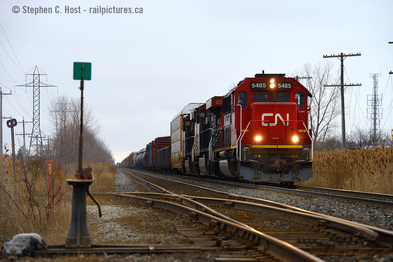 What does a photo mean to you? This is a photo with much meaning for me, and little for anyone else. I grew up in multiple places around the GTHA, and Green Rd was one street I lived on. While I did not take photos in my younger years I sure liked to walk down to the tracks (about 2-3 KM) to watch trains, at exactly this crossing.So of course, It's always on my mind that I should take a photo here, as this location has positive meaning to me. Here's train 422 heading east toward Hamilton and Toronto, in the former City of Stoney Creek.Photo notes; This is also a very difficult if not impossible shot to get, the angle ONLY works in sun around June 22'nd  (give/take a week) and only if you have an eastbound... which are very rare in the late late afternoon except for VIA 98. Not to mention you may not be able to due to shadows.. I haven't tried this yet, but I may this summer.