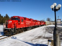 The CPR Waterloo subdivision may be largely unknown to many, but this is a very busy CPR branchline in Ontario (one of only two remaining) and this photo, plus the next will illustrate why. Here we see T99, Wolverton to Hagey turn with about 50 empty autoracks heading timetable north, 1 mile to their destination. While this was happening, TG21, a Hagey based roadswitcher, was southbound returning from the CPR/GEXR Interchange at mile 11.2. I immediately drove north to try and find a spot for it. <a href=http://www.railpictures.ca/?attachment_id=23279>(Next photo)</a><br><br>History of this area: This track was all former Grand River Railway, a CPR leased (99 years in 1908) interurban electric line, and T99 has just crossed what was known as Preston Junction for the hespeler Branch of the GRR - see a photo of a train at Hespeler <a href=http://www.railpictures.ca/?attachment_id=10746</a> here by Cecil Hommerding (Doug Leffler Collection)</a> and just around the river was the GRR shops, as shown in <a href=http://www.railpictures.ca/?attachment_id=22701>This Bill Thomson Photo</a>. The 10 or so miles of the Waterloo subdivision is all that remains of the GRR and LE&N and kind folks who saw the line in its heyday would hardly recognize it today. We're always interested in electric interurban shots, for the kind folks that may have some! :) Provides great contrast to today's diesel dominated railways.