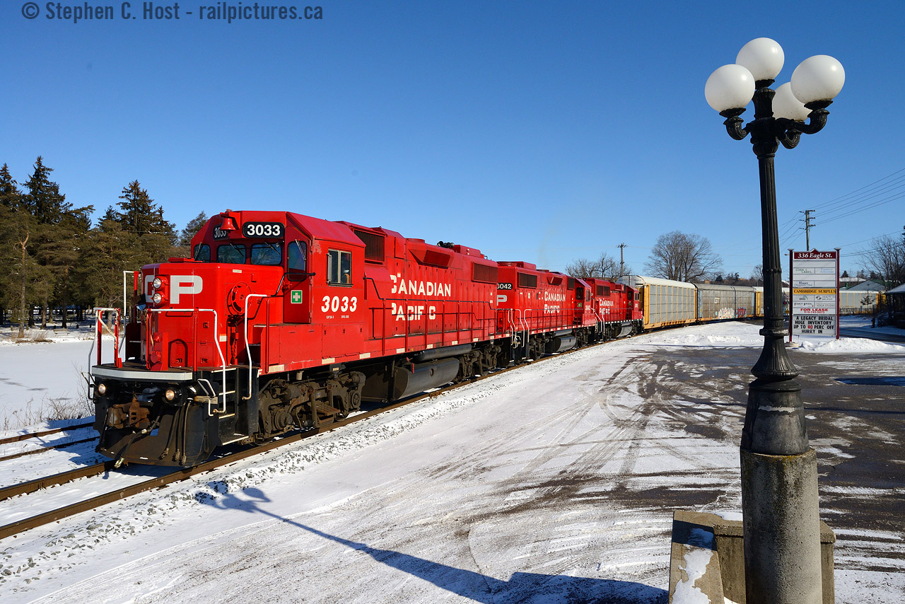 The CPR Waterloo subdivision may be largely unknown to many, but this is a very busy CPR branchline in Ontario (one of only two remaining) and this photo, plus the next will illustrate why. Here we see T99, Wolverton to Hagey turn with about 50 empty autoracks heading timetable north, 1 mile to their destination. While this was happening, TG21, a Hagey based roadswitcher, was southbound returning from the CPR/GEXR Interchange at mile 11.2. I immediately drove north to try and find a spot for it. (Next photo)
History of this area: This track was all former Grand River Railway, a CPR owned interurban electric line, and T99 is actually on the right of way of the former Hespeler Branch of the GRR - see a photo of a train at Hespeler