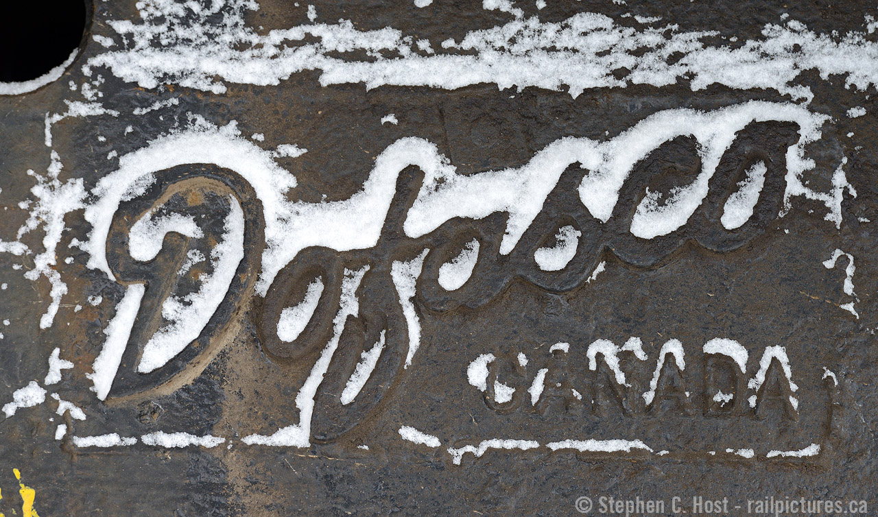 Dofasco trucks, a hallmark of Canadian motive power for decades, highlighted in a dusting of snow after returning from a plow run.