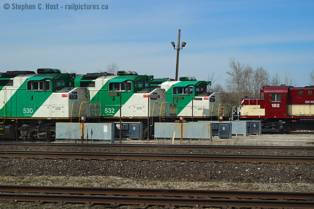 On the Guelph Junction Railway - GO Transit leased GJR property to build a yard in the late 70's, and expanded it in the 1980's - this arrangement continued until the new Milton layover yard was built, which meant as OSR took over switching GJR for a few years you could shoot an odd pairings like this.
182 was since transferred to Salford, GOT 530 to AMT then to SLC, 532 to AMT (then what? Altoona for?), GOT 557 is still on the roster and I'm sure I've shot it in the last year or two on the "L10L's that roam the system.