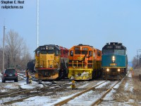 <b>Busy times on the High Iron</b> as VIA 85 passes by two GEXR trains working Kitchener yard. A two way meet may be common, but three way? Took me a 'few years' to have everything come together.. my last three way meet was in 2003 between CN 271 in the hole at Kitchener, CN 434 on the main, and GEXR 584 coming to work the yard, but it did not look this good :)<br><br>Operationally, for those interested, GEXR 518 at left has just returned from South Junction, set off their train in the yard, helped x516 (middle) lift the cars, switched ends and ran to the west end of the yard, to wait for X516 to clear the yard. Extra 516 had come from Stratford earlier that morning light power, lifting cars from Kitchener yard, plus the cars 518 brought from CP to bring about 40 cars to Stratford. Just as 516 cleared the yard, 518 would begin their work to make a second run to South Junction for autoracks. Weekends at Kitchener are always worth a visit.