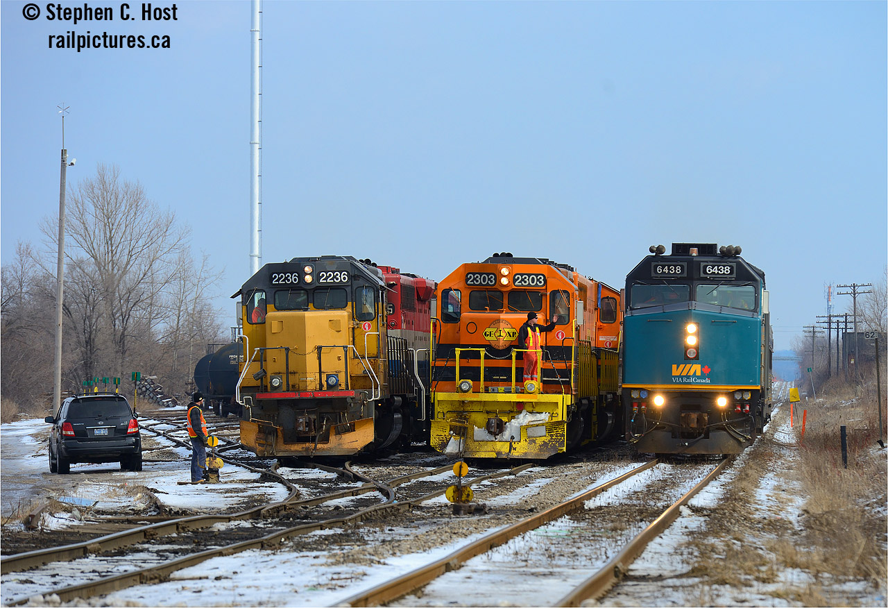 Busy times on the High Iron as VIA 85 passes by two GEXR trains working Kitchener yard. A two way meet may be common, but three way? Took me a 'few years' to have everything come together.. my last three way meet was in 2003 between CN 271 in the hole at Kitchener, CN 434 on the main, and GEXR 584 coming to work the yard, but it did not look this good :)
Operationally, for those interested, GEXR 518 at left has just returned from South Junction, set off their train in the yard, helped 518 lift the cars, switched ends and ran to the west end of the yard, to wait for X516. Extra 516 had come from Stratford earlier that morning light power, lifting cars from Kitchener yard, plus the cars 518 brought from CP to bring about 40 cars to Stratford. Just as 516 cleared the yard, 518 would begin their work to make a second run to South Junction for autoracks. Weekends at Kitchener are always worth a visit.