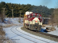Leaning into the curve at Coakley OSR's daily Woodstock job is westbound for CAMI at Ingersoll.