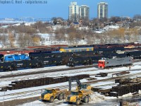 CN/SOR's Hamilton yard is a bit of a buzz of activity, CN 1501 is parking in the yard for the night, while CEFX 2006, now off-lease and elsewhere in this continent (CMQ?) is working the yard. Joe Bishop will like this I think, but those CEFX GP20D's weren't all that pretty :) I should note this shot is growing in ... fast... it won't be too long before these shots are difficult to get owing to growing trees.

