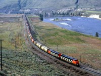 If you see this photo, it is thanks to Joseph Bishop. He was able to edit my original scan to something that was acceptable.
Here is a westbound grain train just east of Juniper Creek Provincial Park. We would find these two lead engines sitting in Boston Bar later in the day. The train was taken west by other engines, I presume.