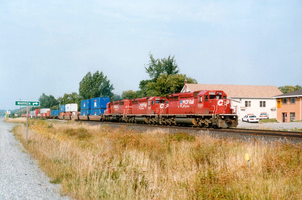 Once the closing of the CP Ottawa Valley line (Chalk River) was announced, that meant stack trains running east of Sudbury were going to be nothing but a memory. This memory captured at the village of Warren, just east of Sudbury with CP 5995, 5975 and 5736 is a prime example. Traffic now runs south to Toronto thru Parry Sound and east from there.