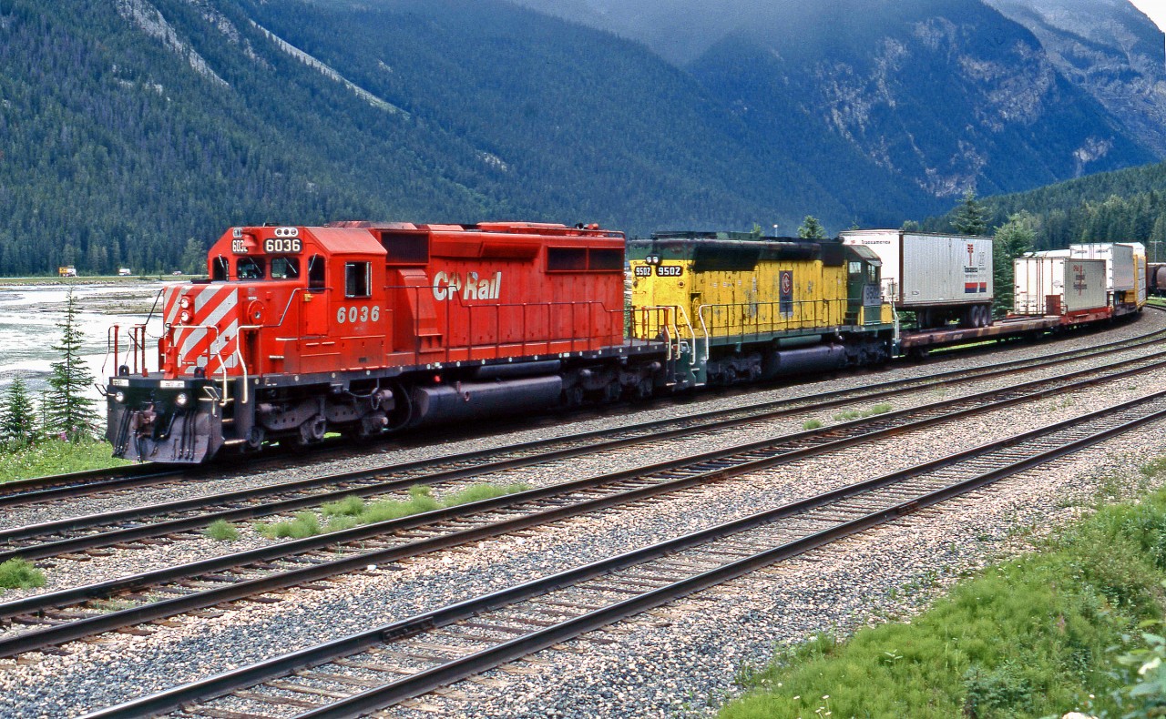 Sitting at the west end of Field yard is SD40-2 CP 6036 and SD45 MKCX 9502 (ex CNW 6490, ex BN 6490).  Notice behind the locos a couple of TOFC units, no longer seen on the railways.