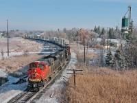 The sun shines bright on this cold spring morning, so I drove up to shoot a few trains on the Bala before the ice melts from the surrounding landscape. Running at full throttle, CN 114's three big units have 11,011 ft of train well in tow for BIT. 