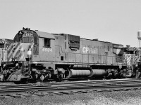 <br>
<br>  
 seventies road power 
<br>
<br>  
 four models, two builders
 <br>
<br>  
 and three of the four were delivered to the CPR in maroon and gray livery.
 <br>
<br>  
 SD40-2   CP Rail 5728  (GMD September 1975) 
 <br>
<br>   
 C-630M  CP Rail 4504  (MLW 1968 )
 <br>
<br>  
 GP35  CP Rail 5021  (GMD 1965 ), the future cab-slug 1128
 <br>
<br>  
 SD40  CP Rail 5514  (GMD 1966 ), the future DM&E 6081
 <br>
<br>  
 On a warm, sunny , spring 1977 Sunday, negative by S.Danko
 <br>
<br>  
 What's interesting:
  <br>
<br>  
 the different types and locations:    classification lights,  horn,  radio antenna,  manual brake wheel / lever
 <br>
<br>  
 consistent location:   the bell,  dual sealed beam head lamp
 <br>
<br>  
  old and new versions:   CP Rail stripes
 <br>
<br>  
 and the one constant:   Canadian Pacific script  lettering on the Agincourt water tower
<br>  
 <br>
<br>  
 CP Rail  regularly paired big six axle power with smaller four axle,( witness here the C-630M  /  GP35 lashup ). More:  
 <br>
<br>  
    <a href="http://www.railpictures.ca/?attachment_id=6554">  M – F   lashup </a> 
 <br>
<br>   
   <a href="http://www.railpictures.ca/?attachment_id=14121">  M – RS   lashup </a> 
 <br>
<br>   
   <a href="http://www.railpictures.ca/?attachment_id=15339">  M – GP – M – C    lashup </a> 
 <br>
<br>   
  <a href="http://www.railpictures.ca/?attachment_id=22043">  GP – SD    lashup </a> 
 <br>
<br>
sdfourty
