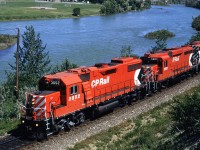 The lead unit isn't that remarkable, but the trailing GP-30 is. It is one of the two such units owned by any Canadian RR (OK SOO had a few but they operated south of the border).
The Bow River is in the background.