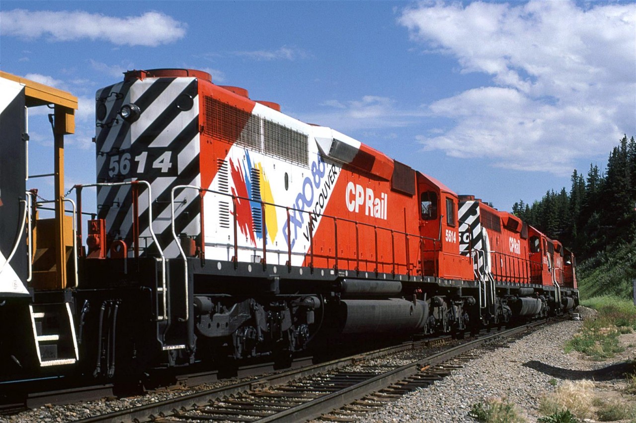 An eastbound cap hop crosses the east switch of Brickburn with the third unit sporting the EXPO '86 paint for CP's "Rainbow Wars" exhibit.
These cab hops mystified me. Did they drop a train at Kieth or did they come a long distance without and revenue car?
