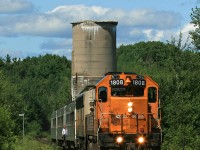 The southbound Northlander slows for the station stop in South River on a warm summer day back in 2009, with the ruins of the old coaling tower in the background. 