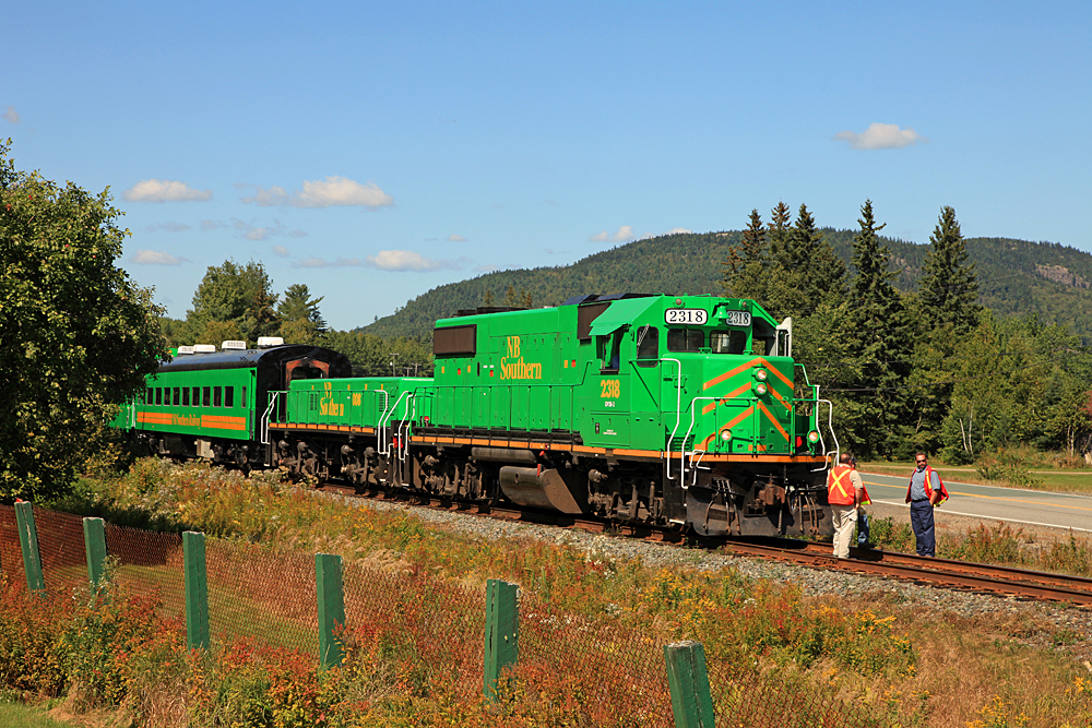 On 9/9/2009 government and railroad dignitaries got together for a photo op to comemmorate a $36M investment for track and equipment (and by extension rail service) improvements in the NBSR service area. The railroad put together this sweet consist to move the VIPs back up the line a ways to observe some trackwork in progress. A big thank-you to engineer Gilles and conductor Chris for giving me the heads-up about this event while chatting with them the day before at McAdam Station, as they waited for clearance to proceed with train 908.